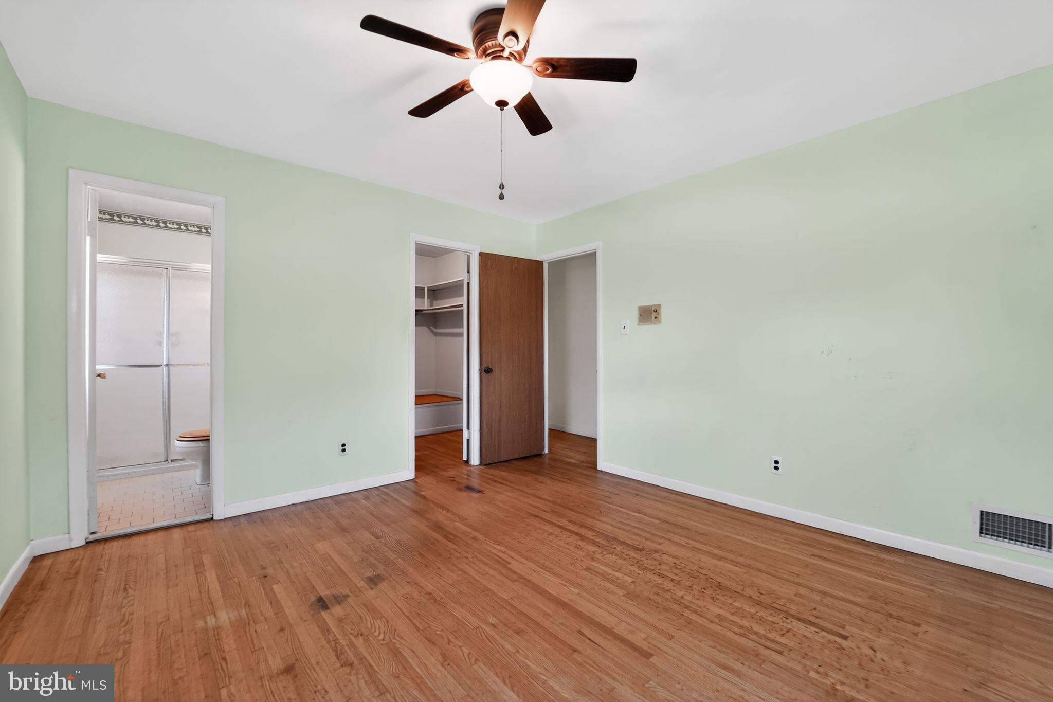 7012 Redmiles Road Laurel, MD 20707 - Photo 23 of 31 a view of room with wooden floor and ceiling fan