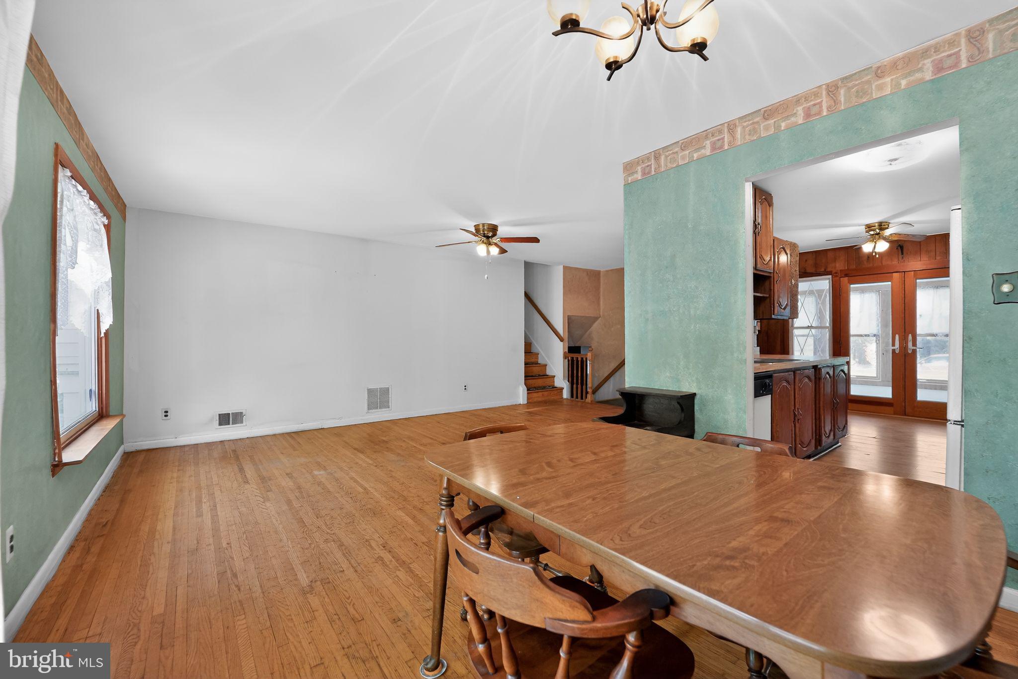 7012 Redmiles Road Laurel, MD 20707 - Photo 8 of 31 a view of kitchen and dining room with wooden floor