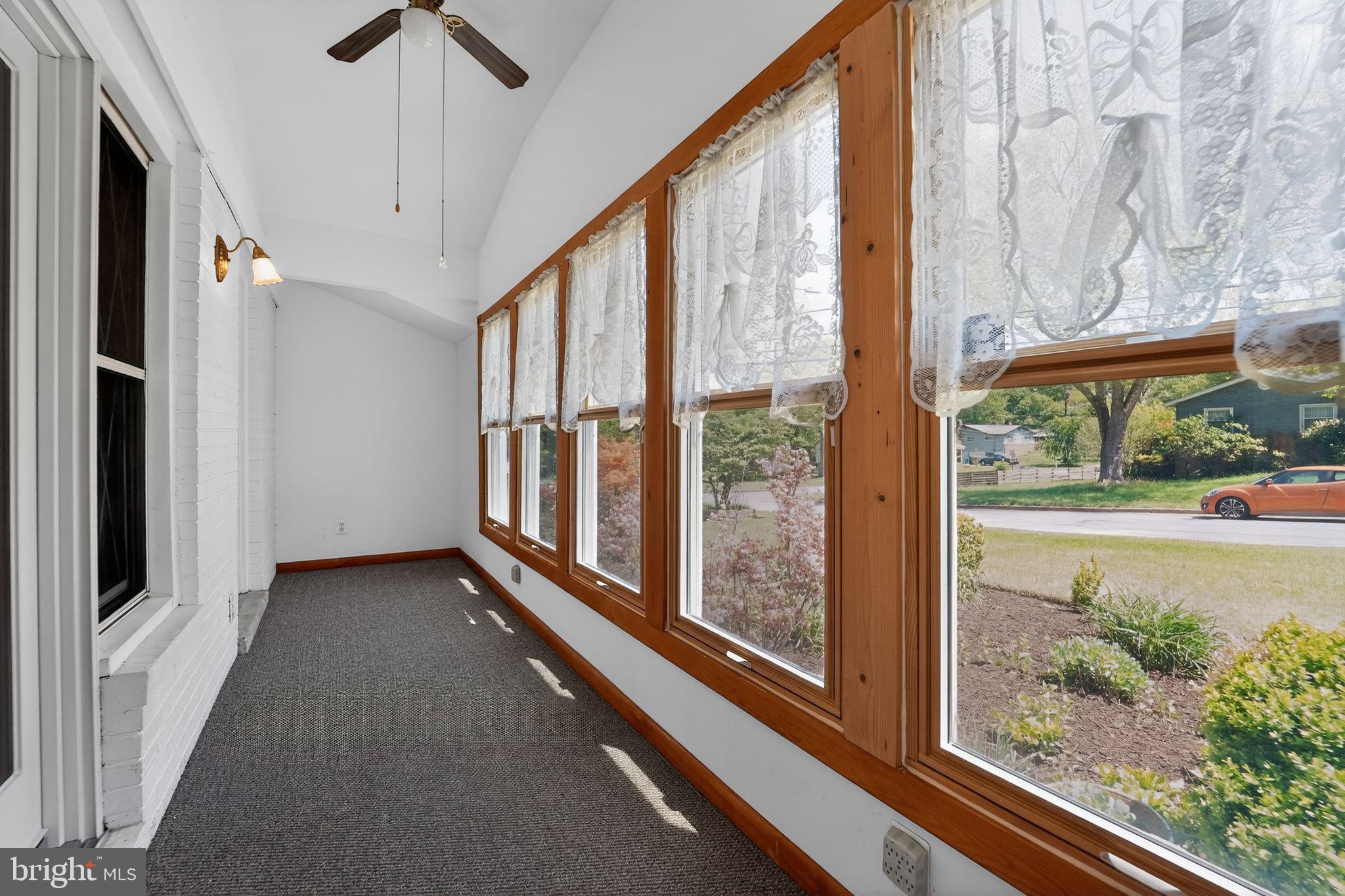 7012 Redmiles Road Laurel, MD 20707 - Photo 9 of 31 a view of a porch with a floor to ceiling window