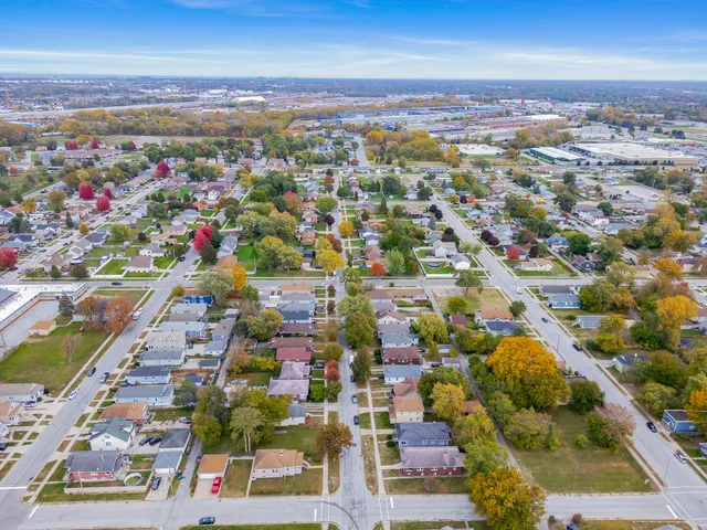 an aerial view of residential houses with outdoor space