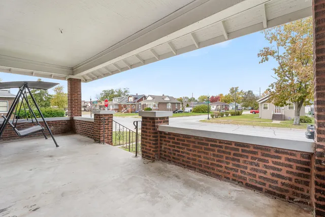 a view of a porch with wooden floor