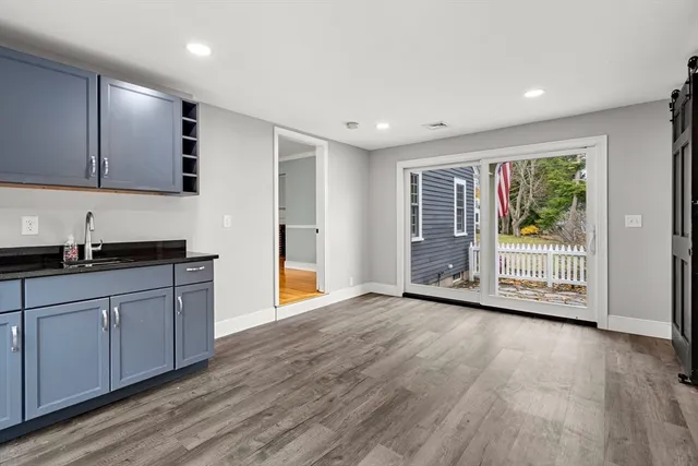 a view of a kitchen with a sink and a window