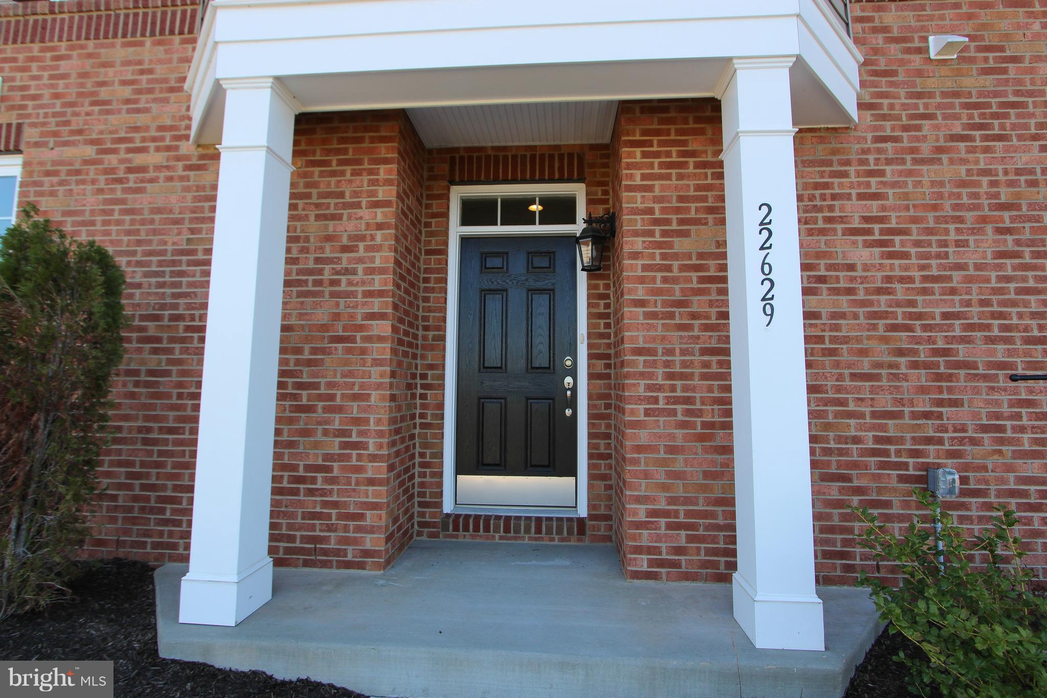 a front view of a house with a door