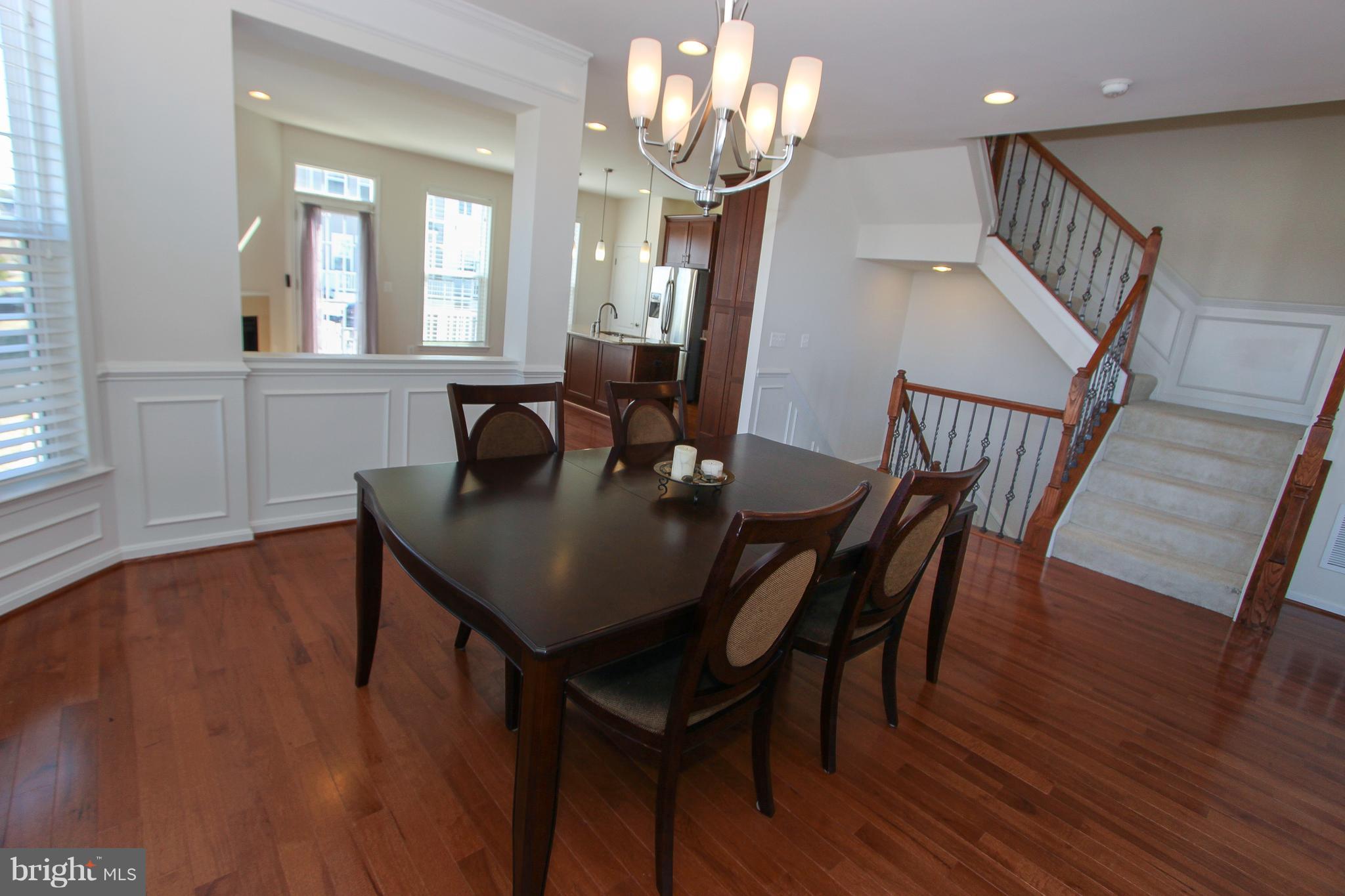 22629 Hawkbill Square Ashburn, VA 20148 - Photo 19 of 30 a view of a dining room with furniture and wooden floor