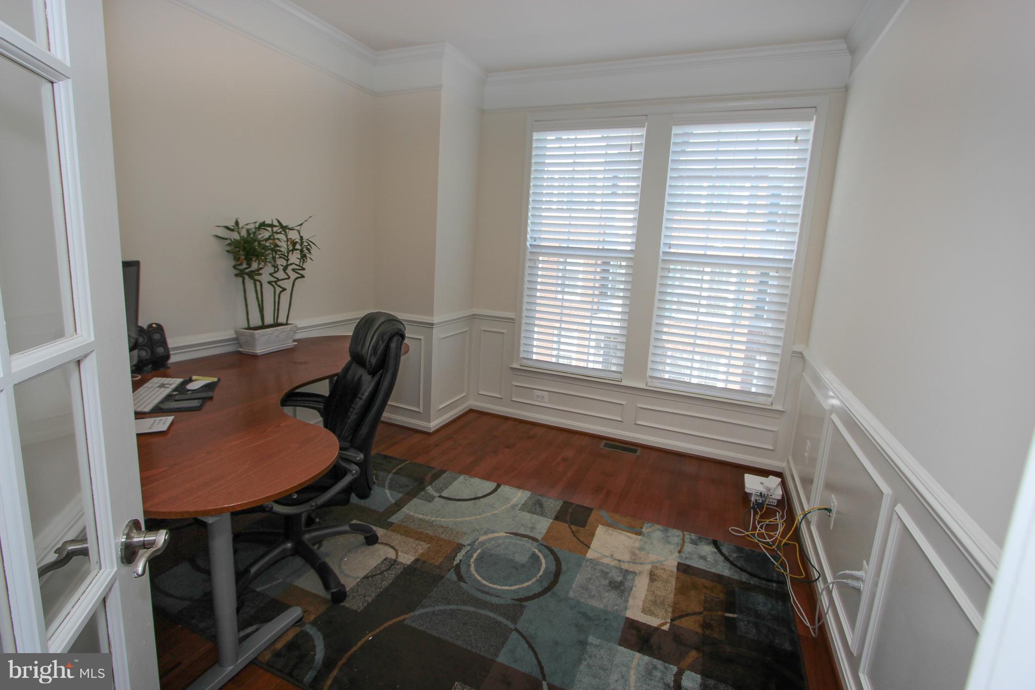 22629 Hawkbill Square Ashburn, VA 20148 - Photo 23 of 30 a workspace with furniture and a window