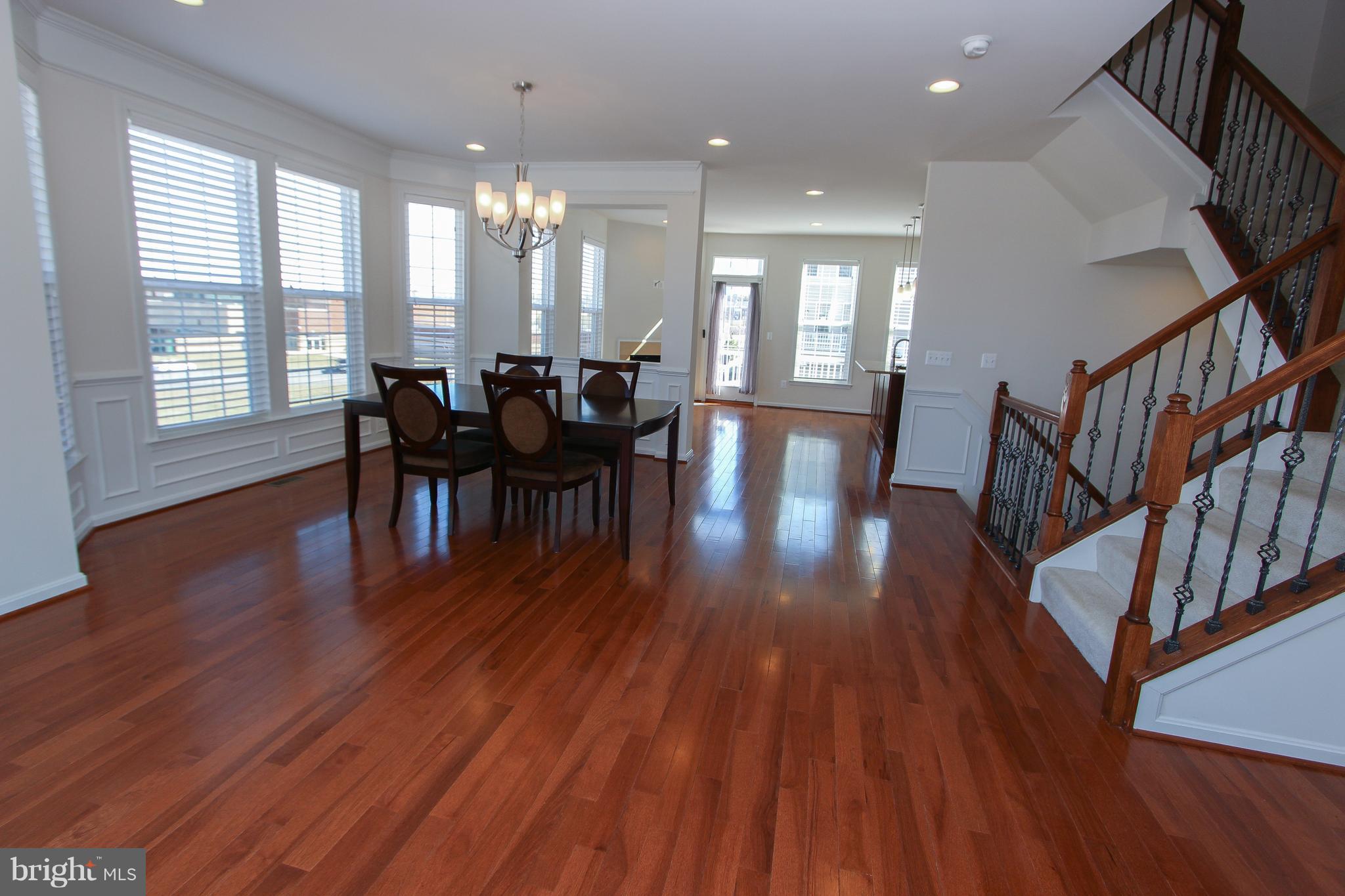 22629 Hawkbill Square Ashburn, VA 20148 - Photo 25 of 30 a view of a dining room with furniture and wooden floor