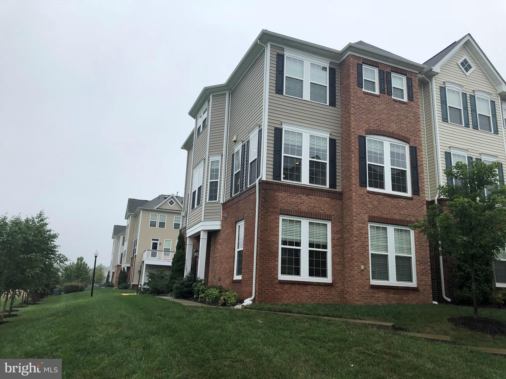 22629 Hawkbill Square Ashburn, VA 20148 - Photo 30 of 30 a brick building with a yard