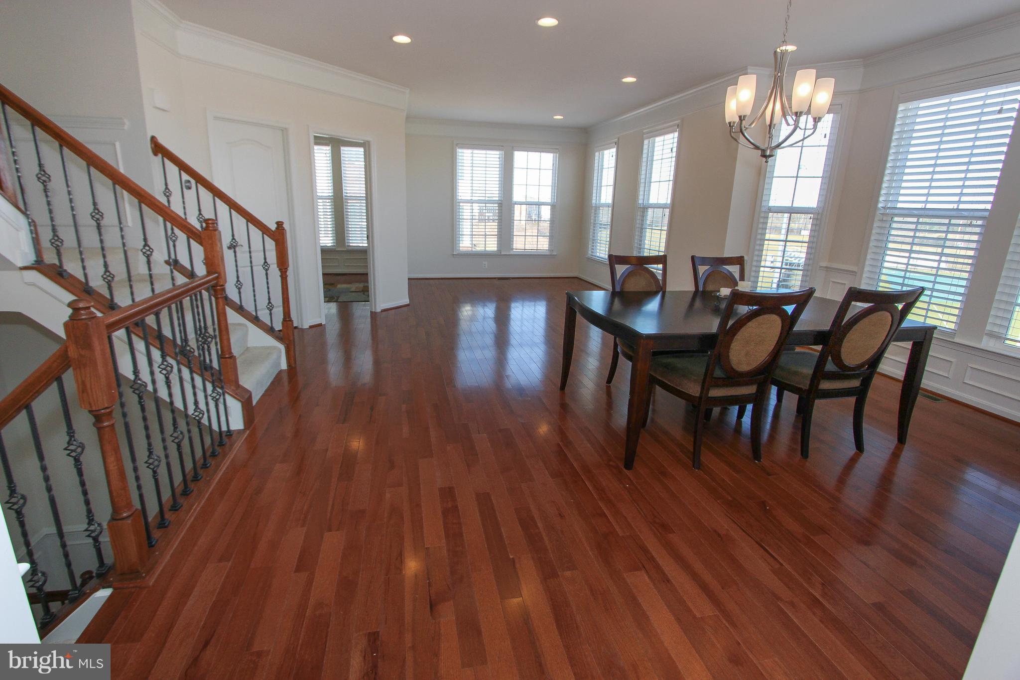 22629 Hawkbill Square Ashburn, VA 20148 - Photo 6 of 30 a view of a dining room with furniture and wooden floor
