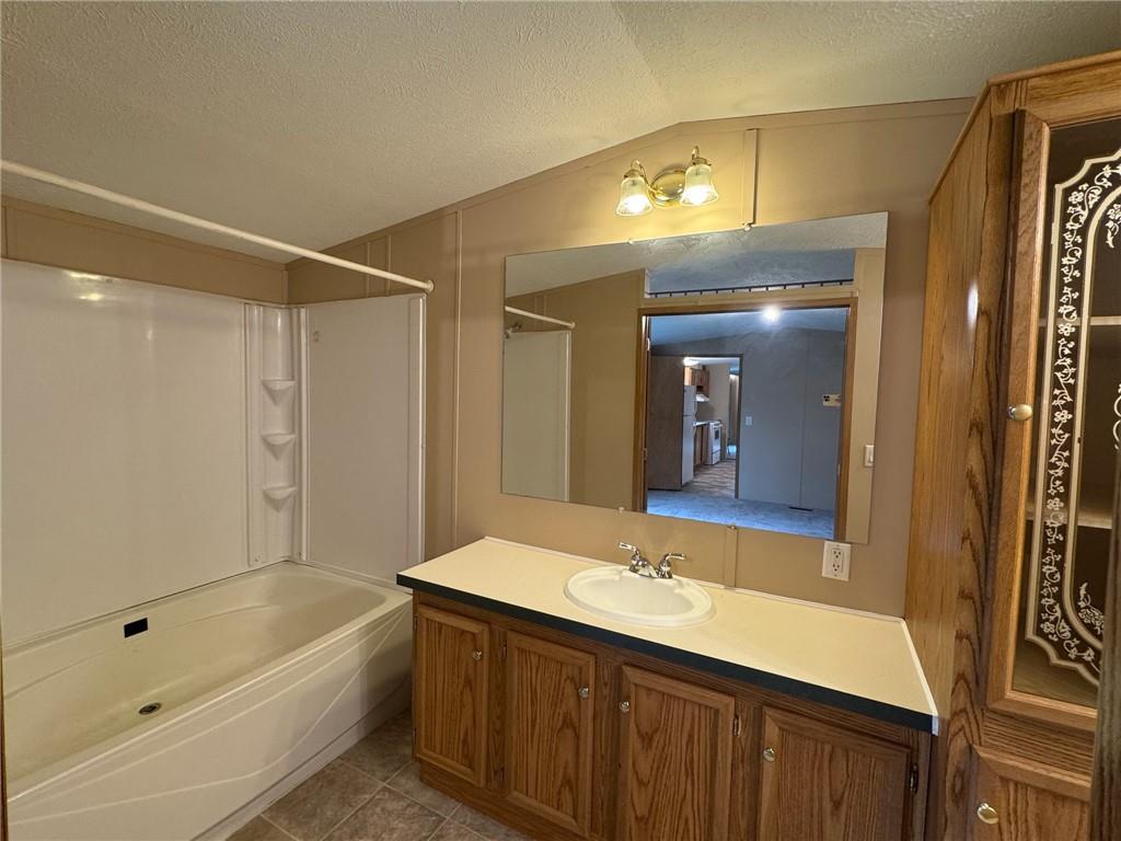 220 Heller Road Butler, PA 16002 - Photo 11 of 17 a bathroom with a bathtub shower sink and mirror