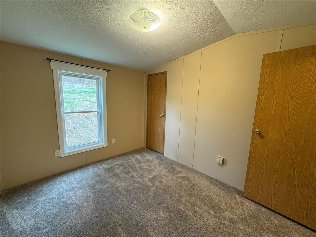 220 Heller Road Butler, PA 16002 - Photo 13 of 17 a view of an empty room with a window