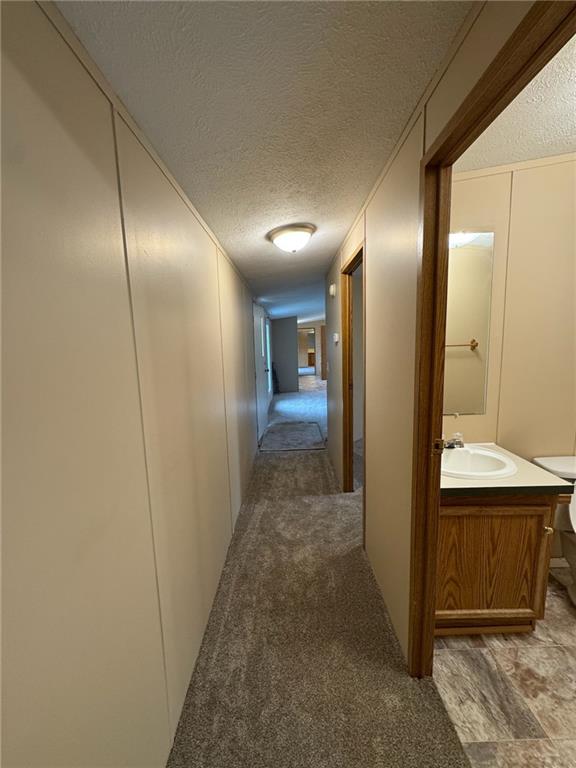 220 Heller Road Butler, PA 16002 - Photo 16 of 17 a view of a hallway with wooden floor