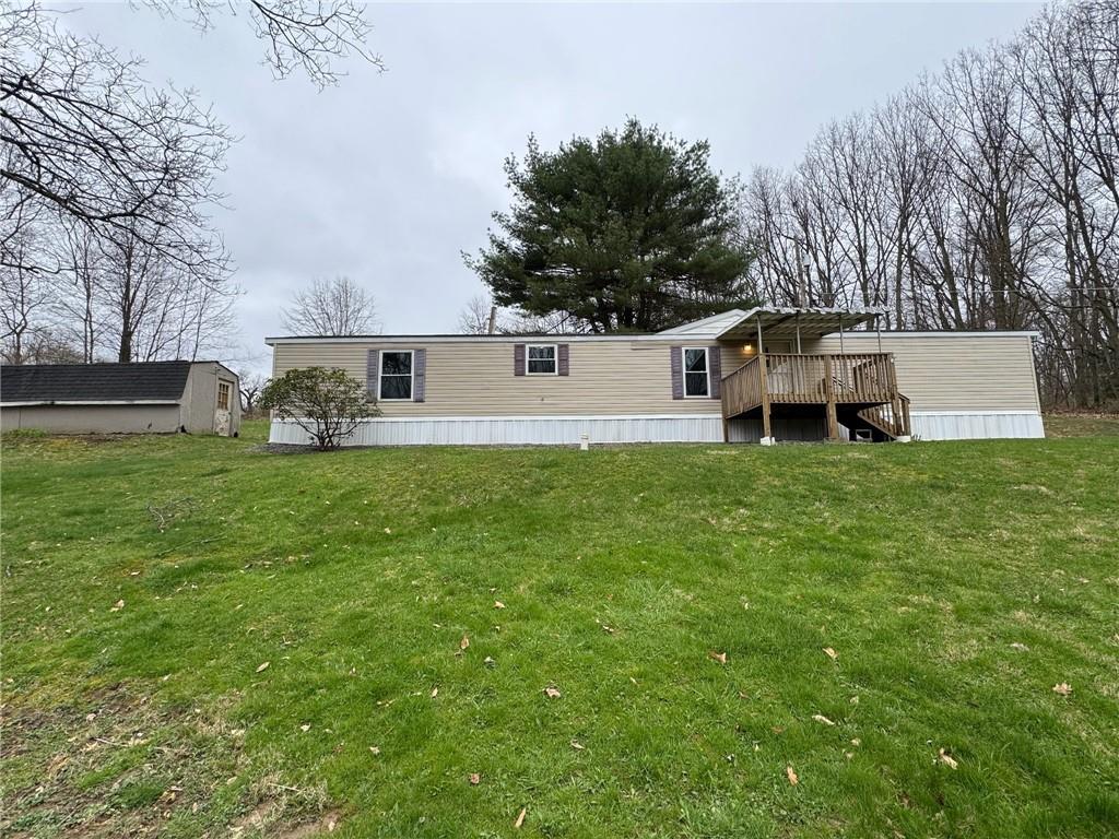220 Heller Road Butler, PA 16002 - Photo 3 of 17 a view of a house with a yard and sitting area