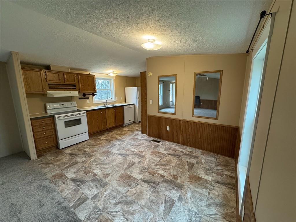 220 Heller Road Butler, PA 16002 - Photo 7 of 17 a room with a stove and a refrigerator