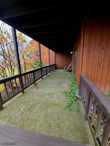 a backyard of a house with lots of green space and plants