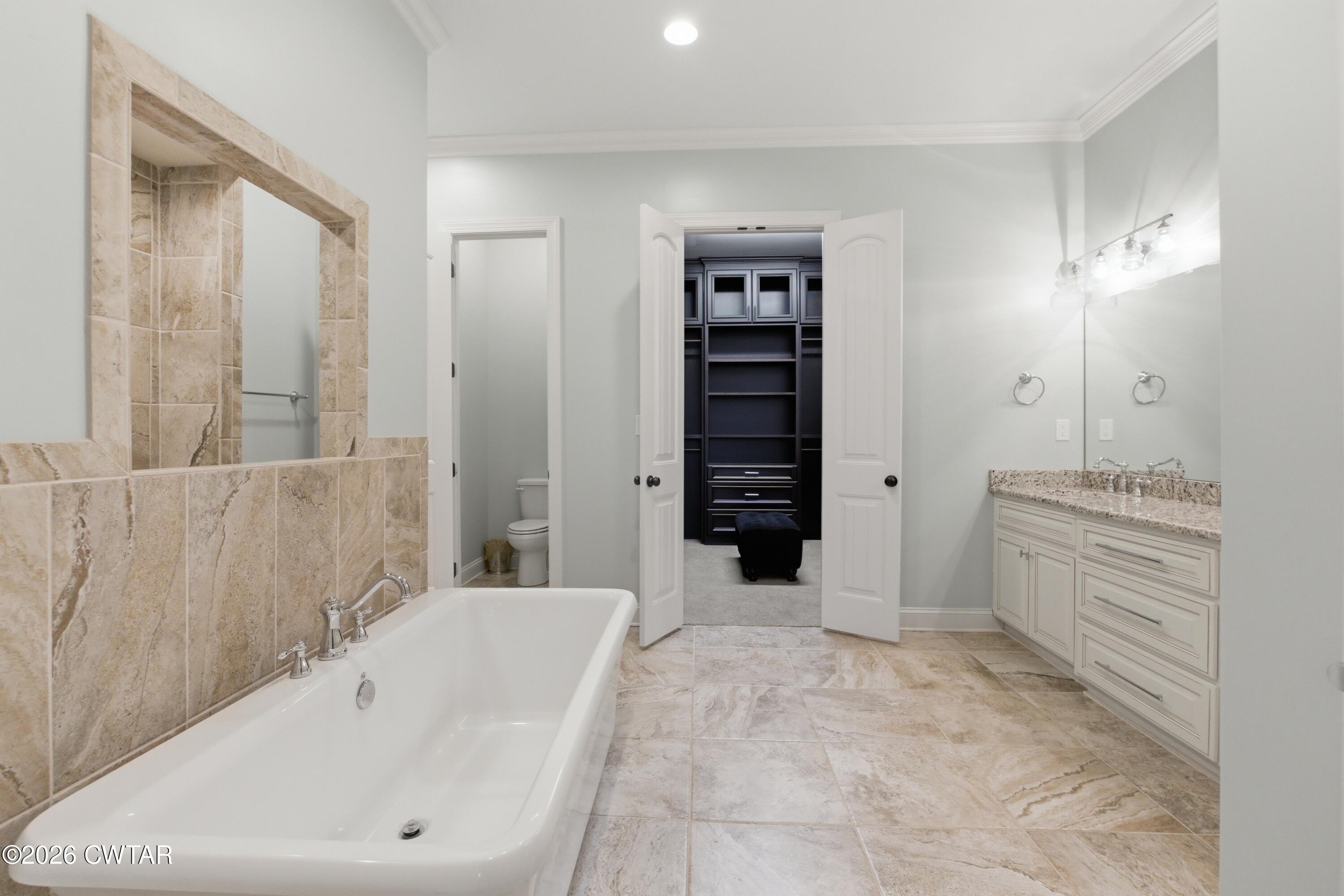963 Ashport Road Jackson, TN 38305 - Photo 27 of 60 a bathroom with a bathtub and a shower