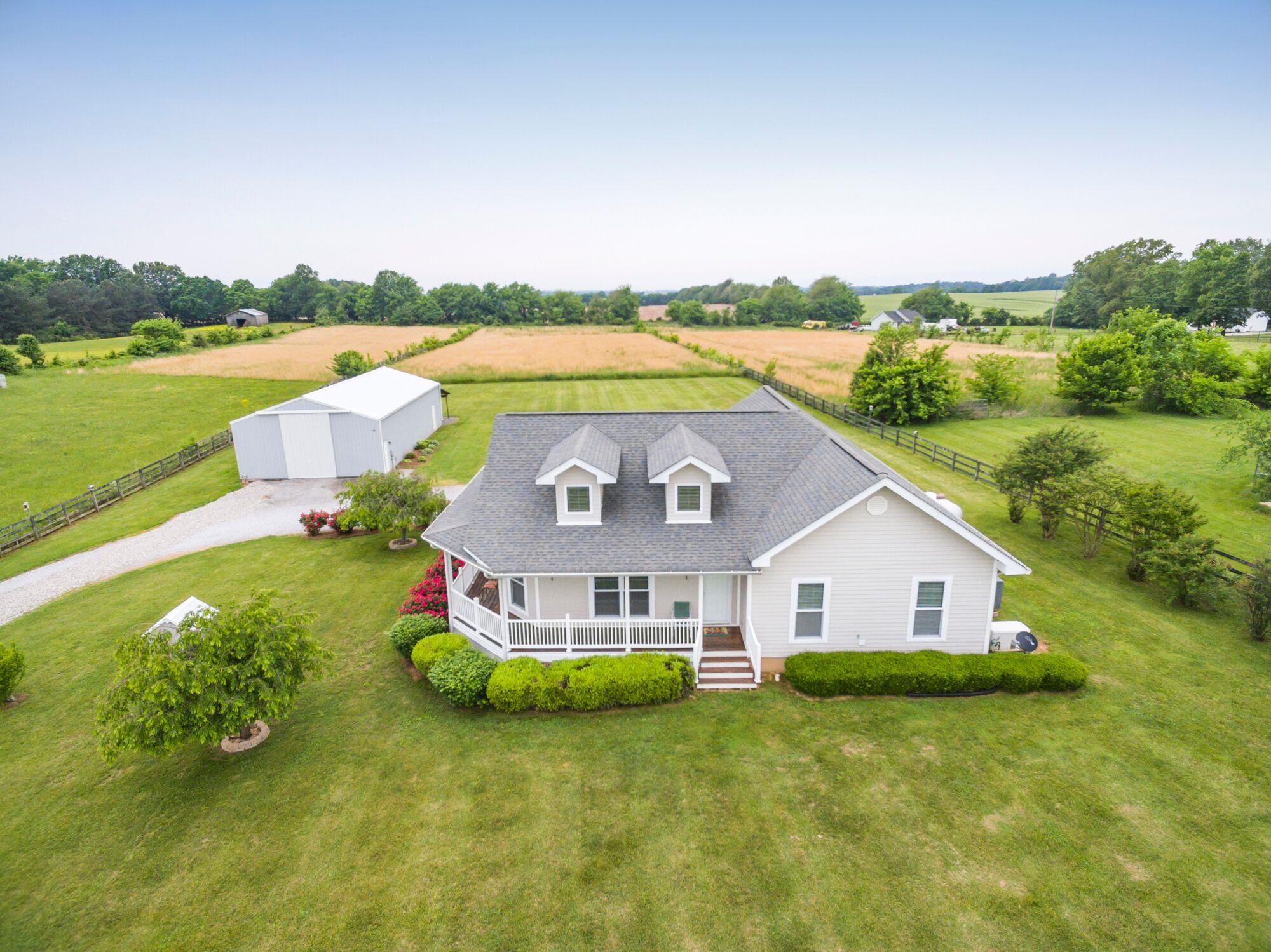 5154 Youngville Road Springfield, TN 37172 - Photo 1 of 30 a aerial view of a house with swimming pool and a yard