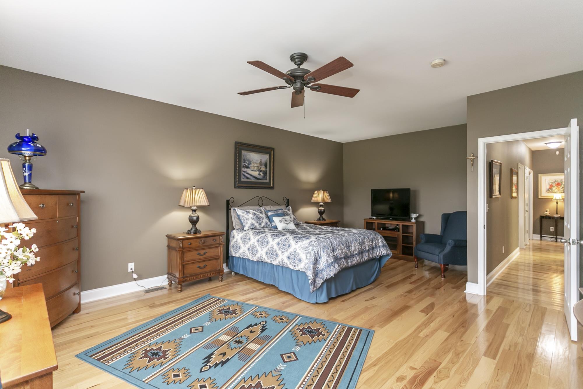 5154 Youngville Road Springfield, TN 37172 - Photo 10 of 30 a spacious bedroom with a bed and wooden floor