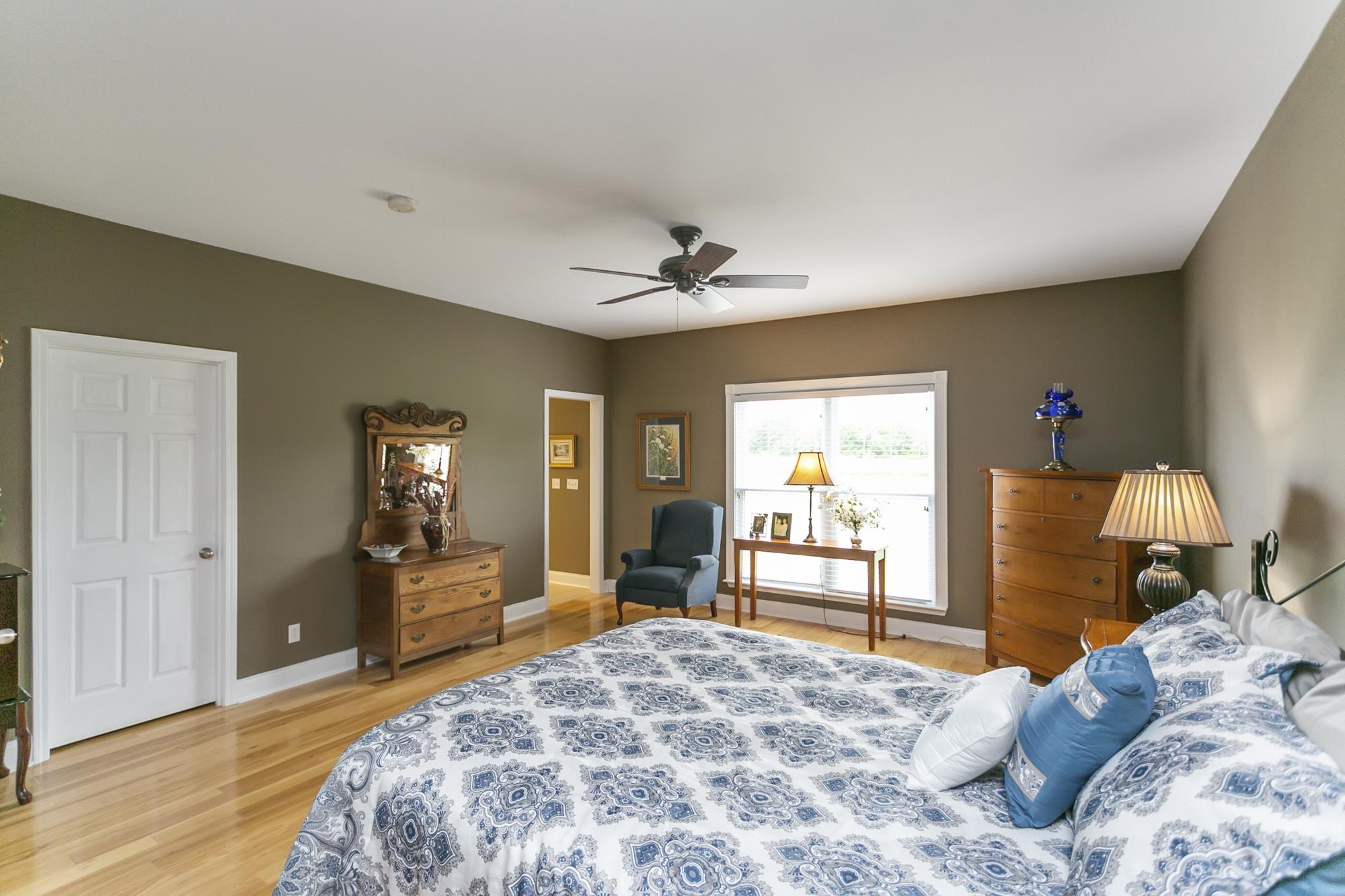 5154 Youngville Road Springfield, TN 37172 - Photo 11 of 30 a bedroom with a bed and a large mirror with table chair