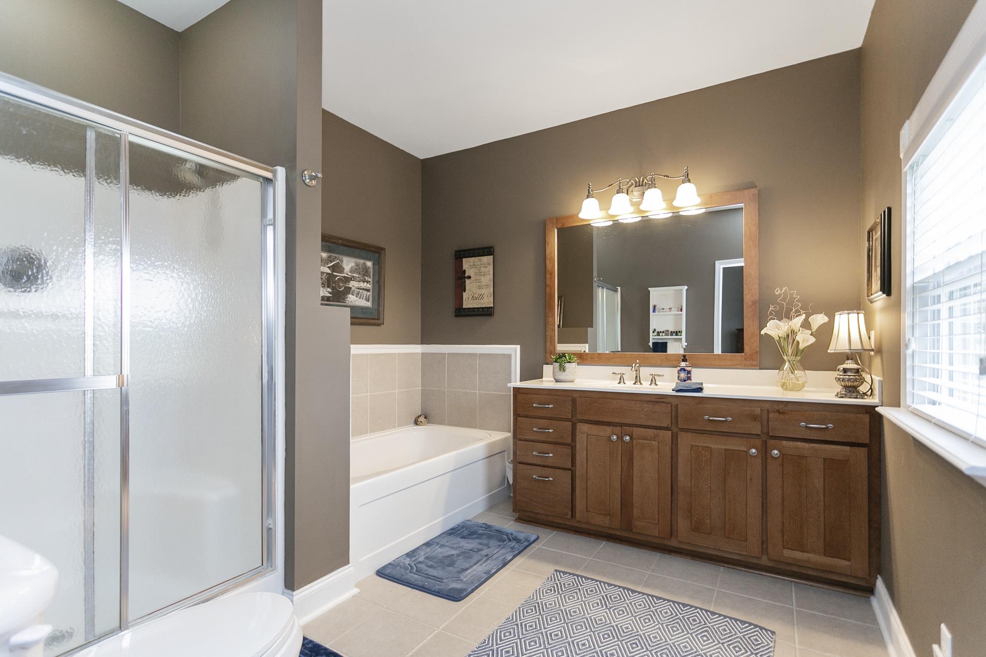 5154 Youngville Road Springfield, TN 37172 - Photo 12 of 30 a spacious bathroom with a tub sink and mirror