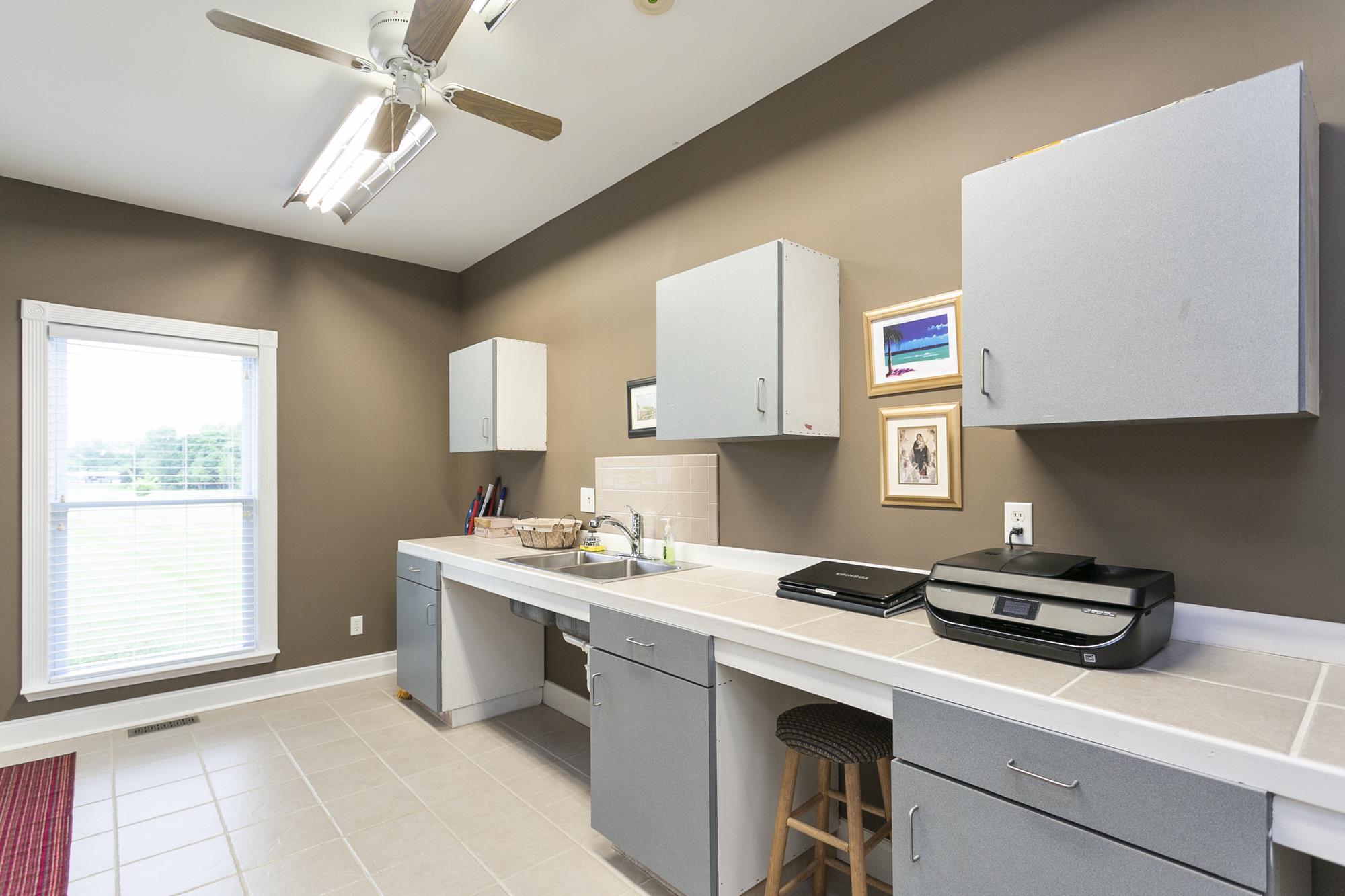 5154 Youngville Road Springfield, TN 37172 - Photo 14 of 30 a kitchen with a sink cabinets and window