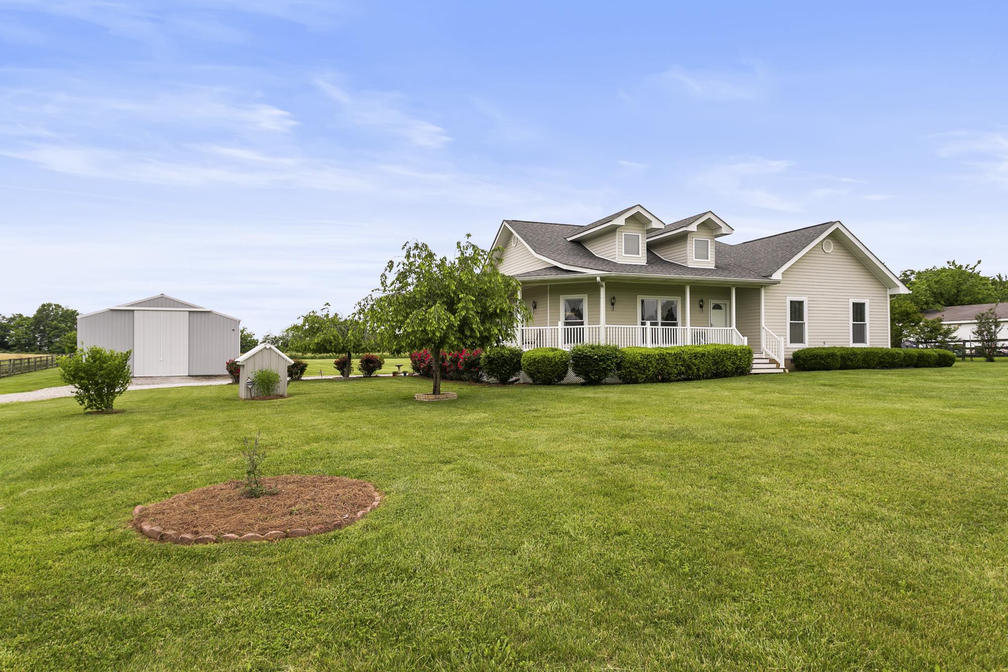 5154 Youngville Road Springfield, TN 37172 - Photo 22 of 30 a front view of a house with a yard and trees