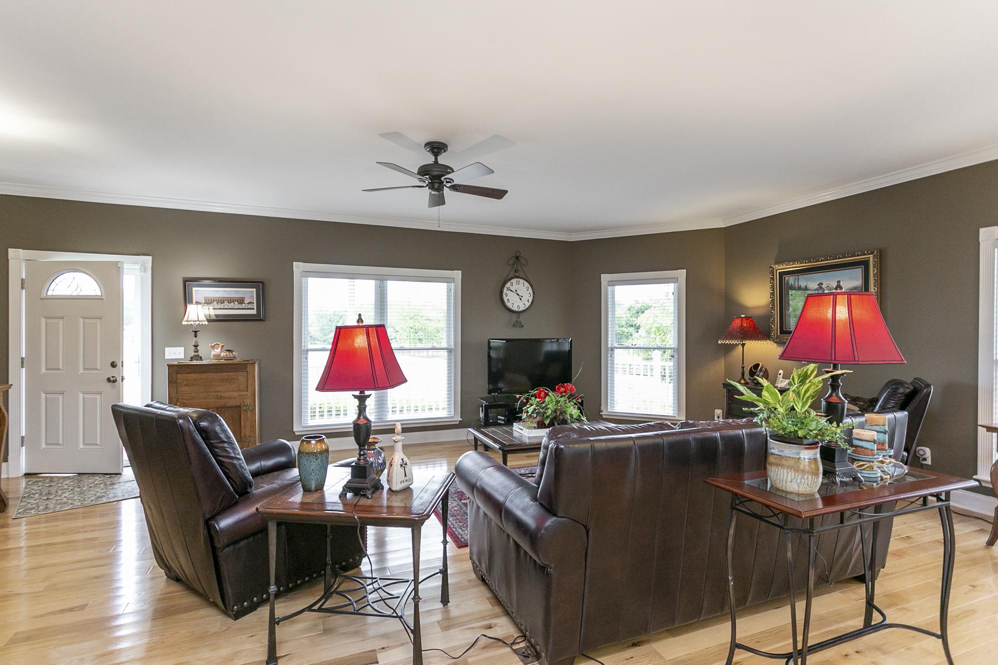 5154 Youngville Road Springfield, TN 37172 - Photo 3 of 30 a living room with furniture a chandelier and a flat screen tv