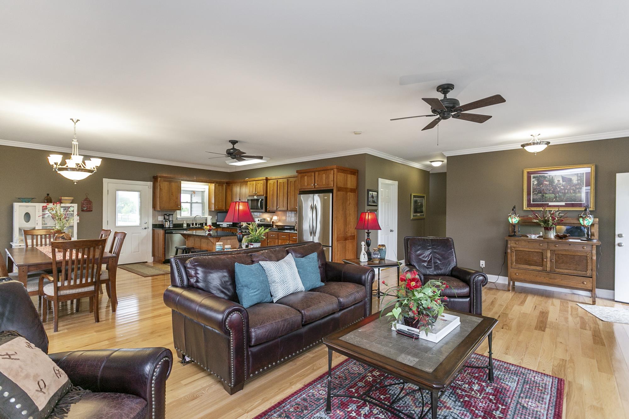 5154 Youngville Road Springfield, TN 37172 - Photo 4 of 30 a living room with furniture and a chandelier