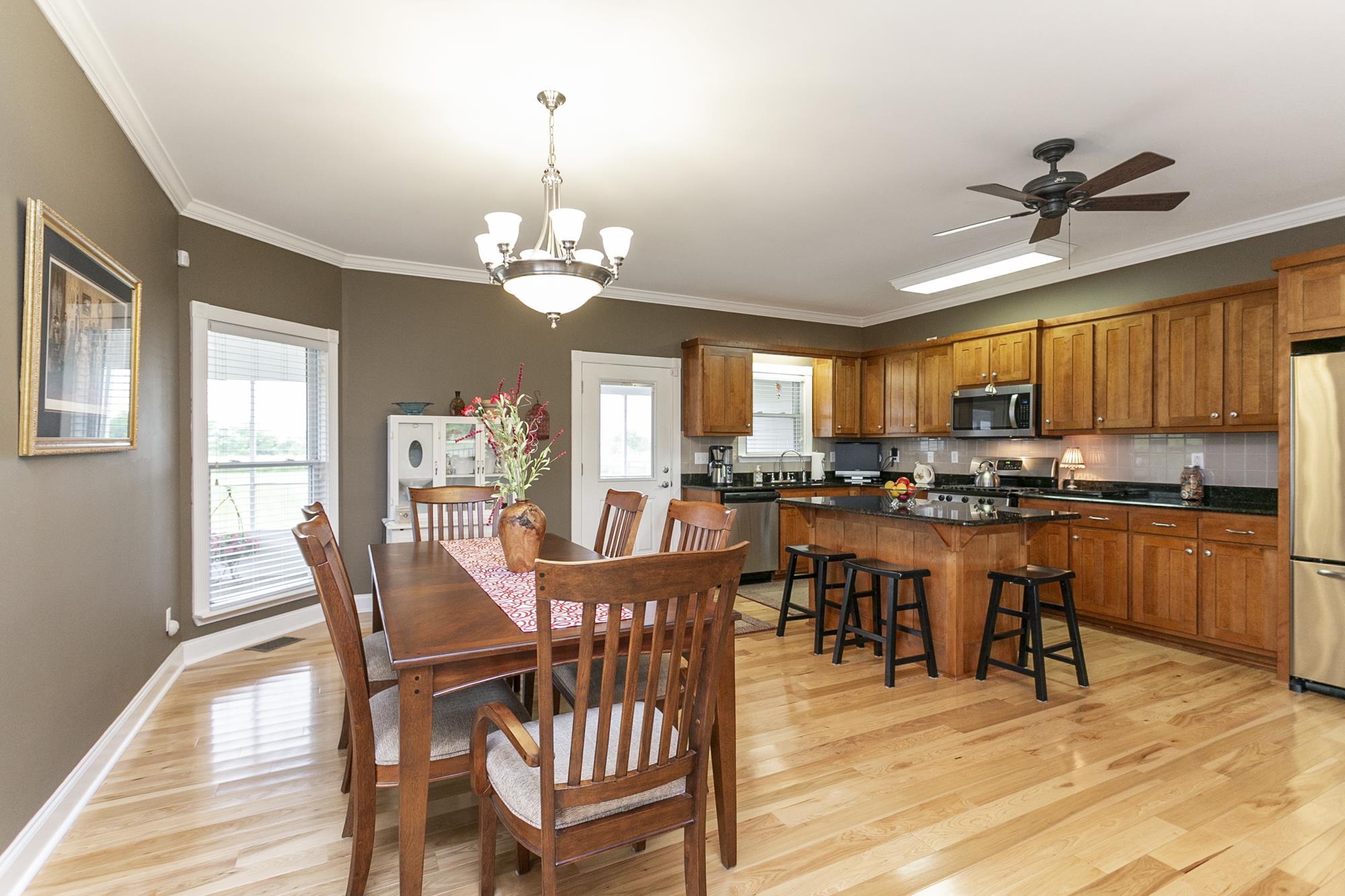 5154 Youngville Road Springfield, TN 37172 - Photo 5 of 30 a view of a dining room with furniture window and wooden floor