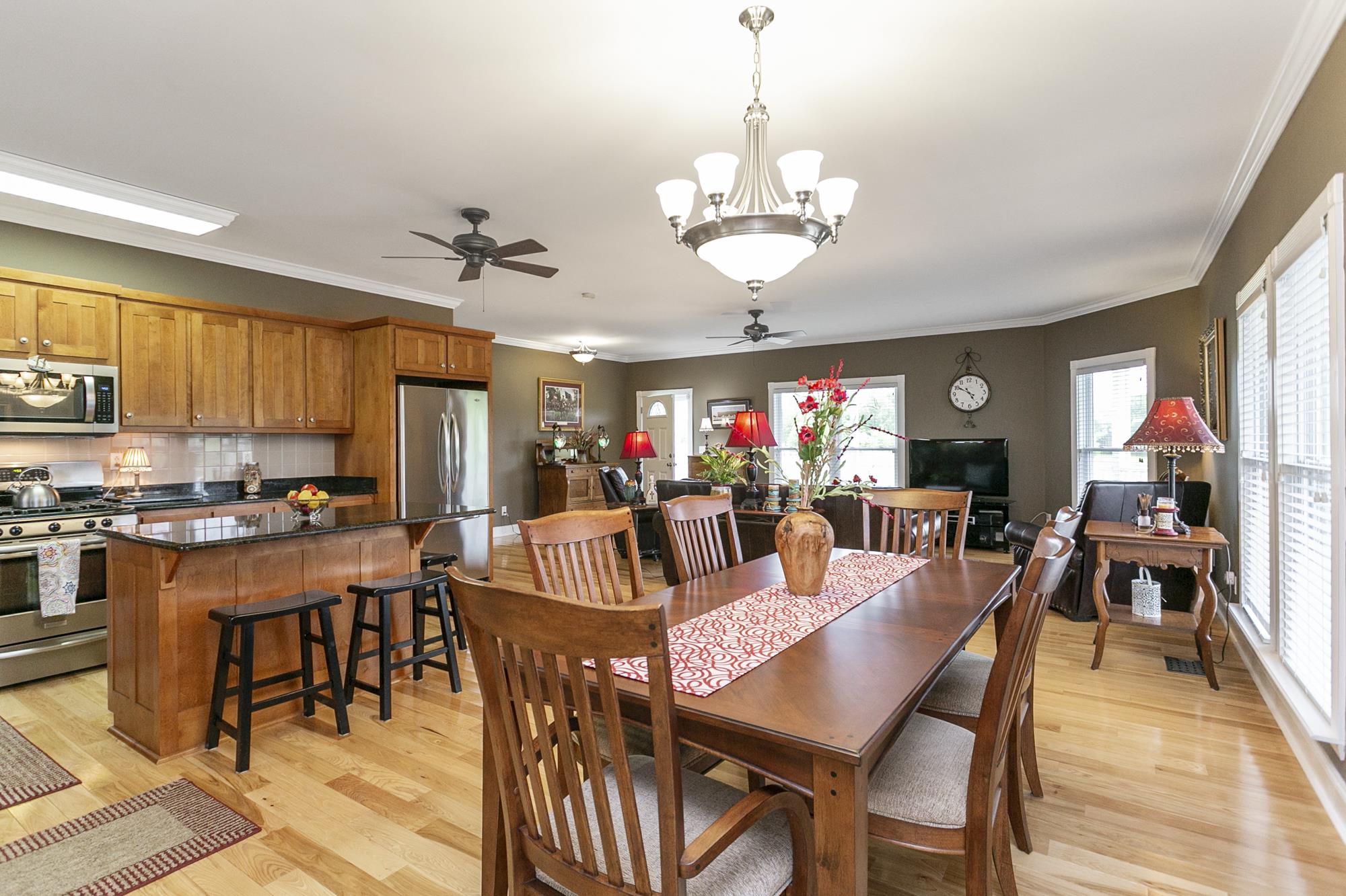 5154 Youngville Road Springfield, TN 37172 - Photo 9 of 30 a view of a dining room with furniture a chandelier and wooden floor