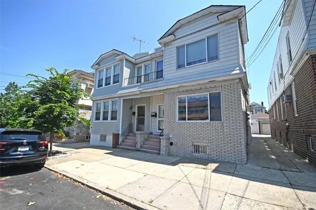 a front view of a house with yard
