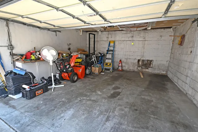 a view of a garage with rack and bicycle