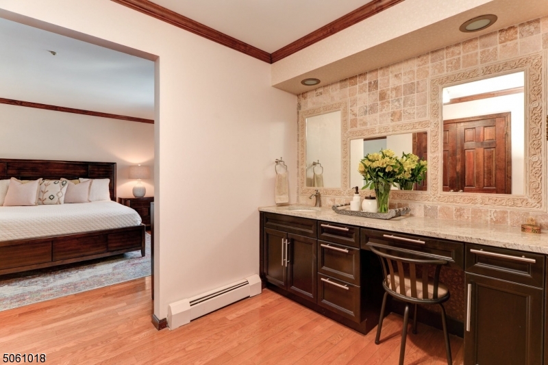 600 North Monroe Street Ridgewood, NJ 07450 - Photo 11 of 18 a bathroom with a sink and a mirror
