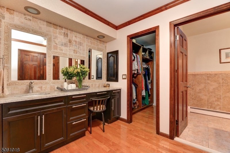 600 North Monroe Street Ridgewood, NJ 07450 - Photo 12 of 18 a spacious bathroom with a sink and a mirror