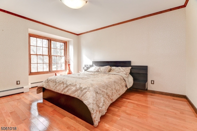 600 North Monroe Street Ridgewood, NJ 07450 - Photo 14 of 18 a bedroom with a bed and window