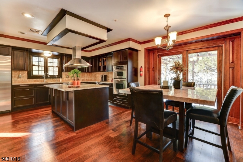 600 North Monroe Street Ridgewood, NJ 07450 - Photo 7 of 18 a view of a dining room with furniture window and wooden floor