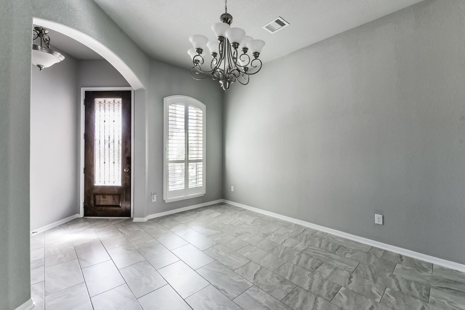 1118 Mysterium Lane Rosenberg, TX 77469 - Photo 6 of 38 Versatile dining space enhanced by porcelain tile flooring and open sightlines.