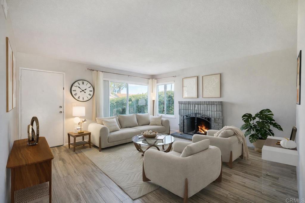 4413 Point Degada Oceanside, CA 92058 - Photo 11 of 46 a living room with furniture and a fireplace