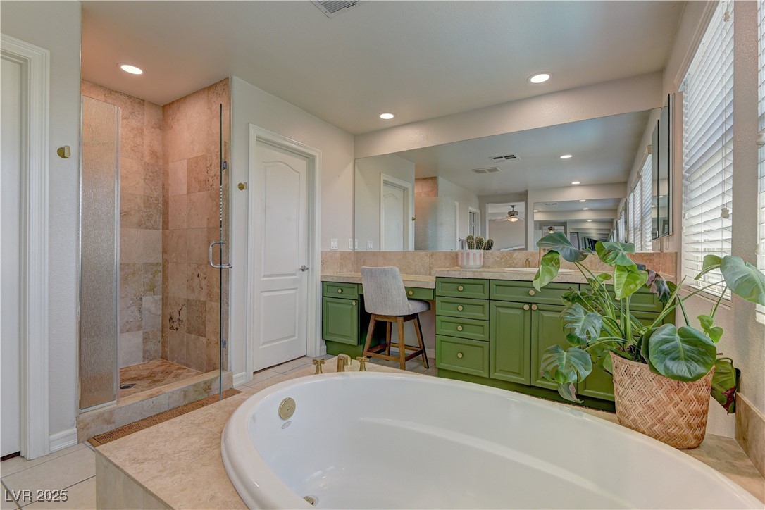 9992 South Sky Parlor Road Las Vegas, NV 89178 - Photo 24 of 42 Bathroom with vanity, recessed lighting, a stall shower, and a garden tub