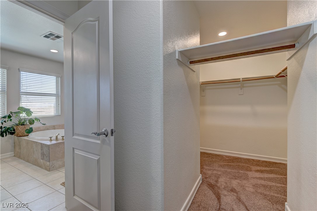 9992 South Sky Parlor Road Las Vegas, NV 89178 - Photo 27 of 42 Spacious closet with tile patterned flooring and visible vents