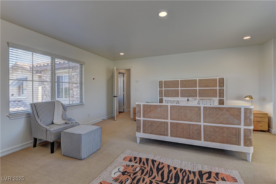 9992 South Sky Parlor Road Las Vegas, NV 89178 - Photo 29 of 42 Bedroom with baseboards, recessed lighting, and light colored carpet