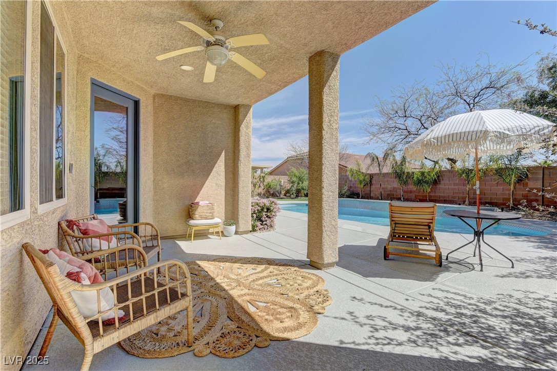 9992 South Sky Parlor Road Las Vegas, NV 89178 - Photo 37 of 42 View of patio / terrace with a fenced backyard, a fenced in pool, and a ceiling fan