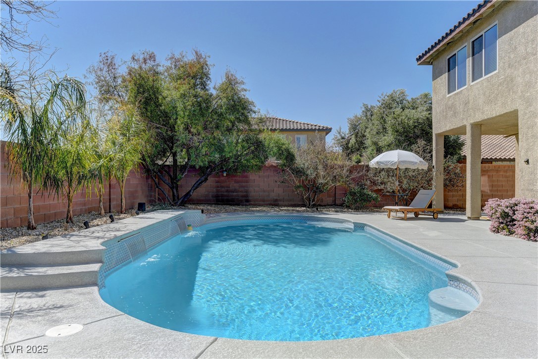 9992 South Sky Parlor Road Las Vegas, NV 89178 - Photo 39 of 42 View of swimming pool with a fenced in pool, a patio area, and a fenced backyard