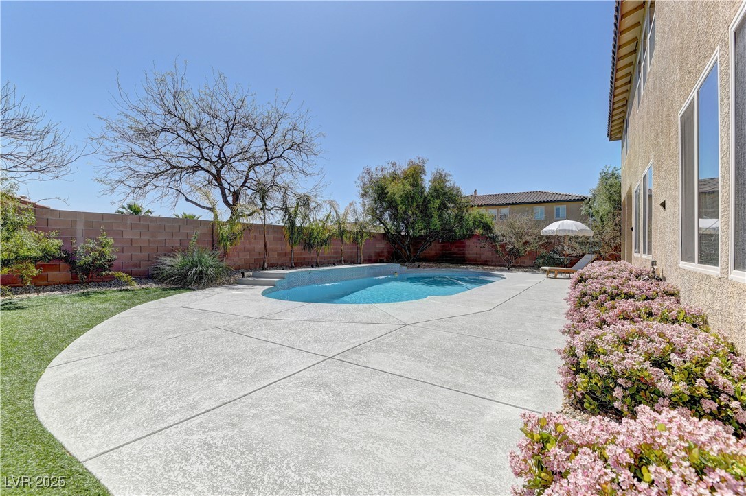 9992 South Sky Parlor Road Las Vegas, NV 89178 - Photo 40 of 42 View of swimming pool with a fenced backyard, a fenced in pool, and a patio area