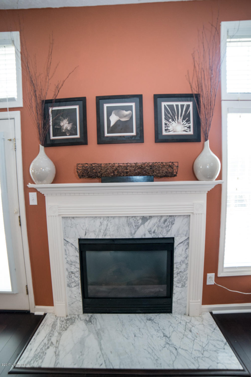 17520 Curry Branch Road Louisville, KY 40245 - Photo 10 of 45 The gas log fireplace is accented by a white mantle and creates a dramatic focal point, highlighted by exquisite trim work detail and marble hearth and surround