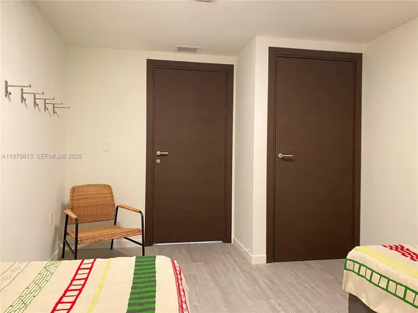 a room with a chair and a rug