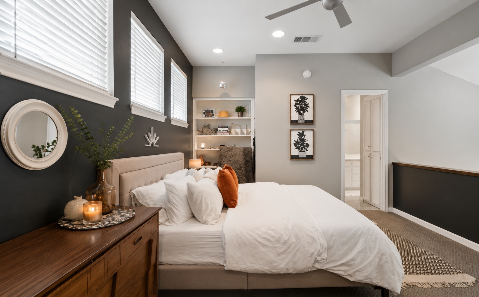 611 East 45th Street, Unit 25 Austin, TX 78751 - Photo 18 of 21 Recessed lighting illuminating a spacious room featuring built-in shelving, multiple windows with blinds, and a ceiling fan