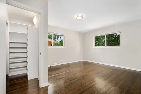 a bathroom with a tub sink toilet and a mirror
