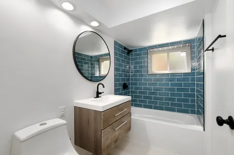 a bedroom with a bed and a table