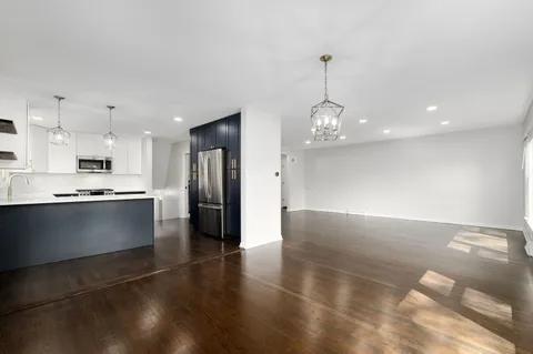 a kitchen with stainless steel appliances a refrigerator sink and cabinets