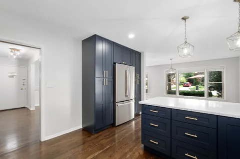 a spacious bedroom with a bed and a window